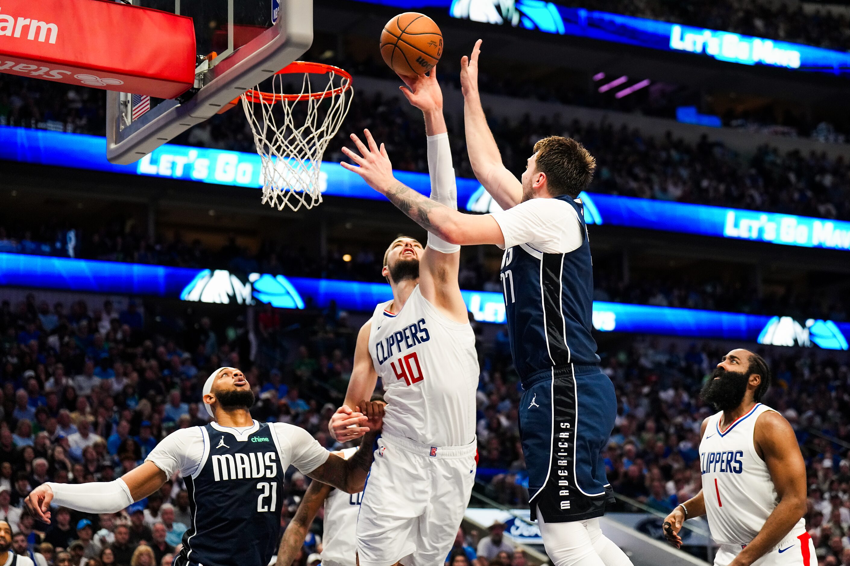 LA Clippers center Ivica Zubac (40) blocks a shot by Dallas Mavericks guard Luka Doncic (77)...