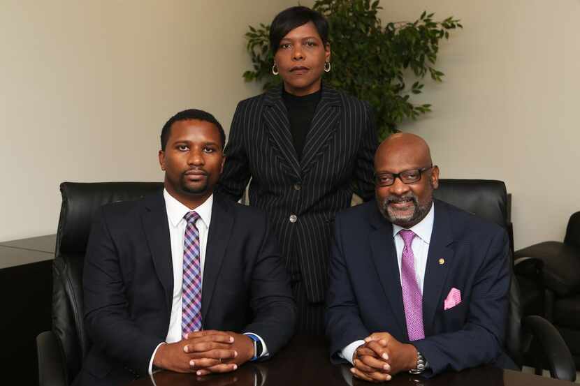 From left: Attorney Keron Wright, Delsa Thomas, the defendant, and attorney Aaron Wiley pose...