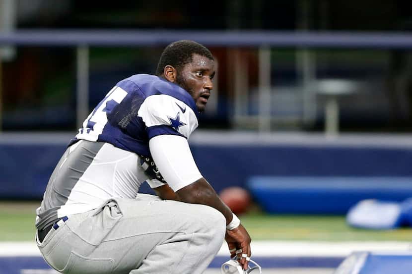 Dallas Cowboys middle linebacker Rolando McClain (55) observes in between drills during...
