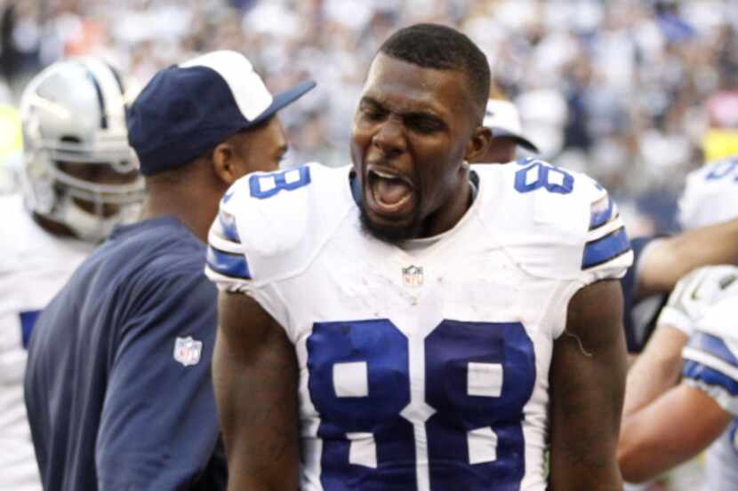 Dallas Cowboys wide receiver Dez Bryant (88) screams on the sideline after the game winning...