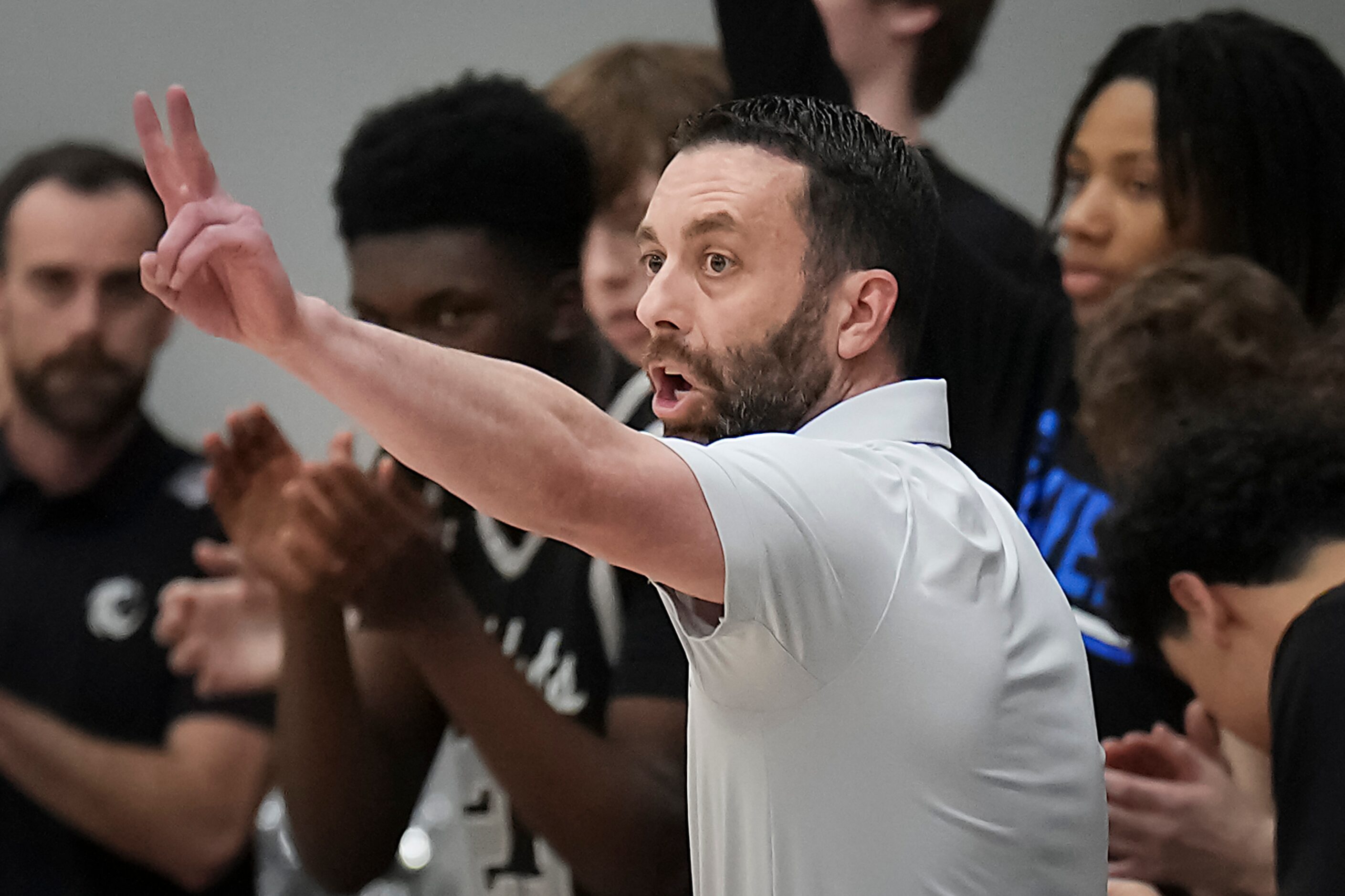 Denton Guyer head coach Grant Long motions ot his players during the first half of a boys...