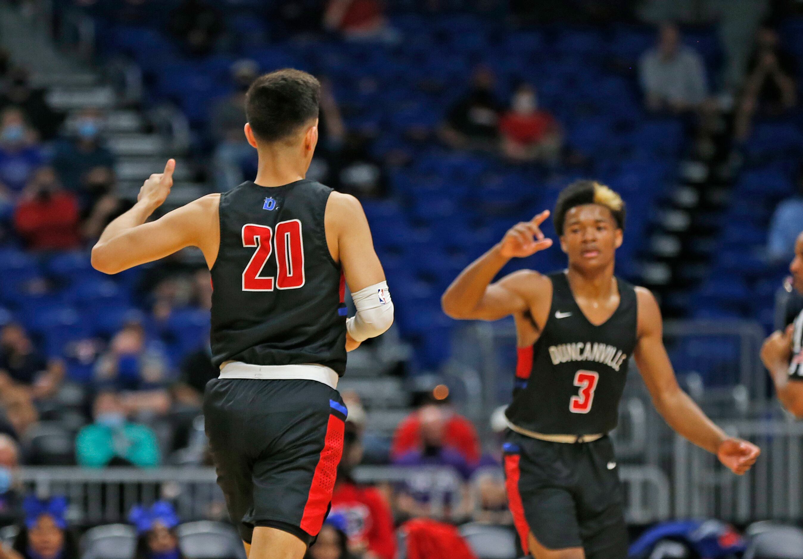 Duncanville Juan Reyna #20 celebrates his three. UIL boys Class 6A basketball state...