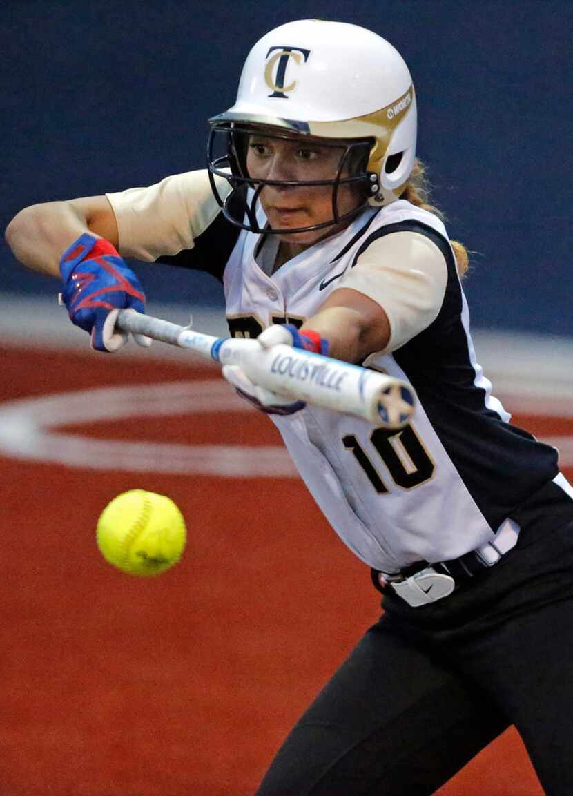 The Colony shortstop Jayda Coleman (10) lays down a bunt it the third inning as Forney High...