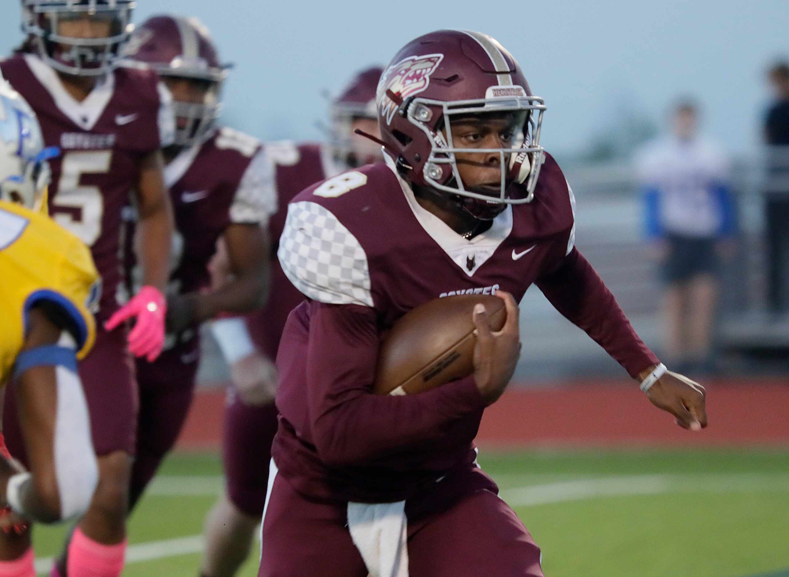 Frisco Heritage High School quarterback Jiyere Cogshell (8) runs the football during the...