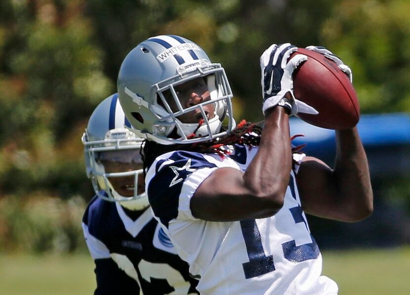 Dallas Cowboys receiver Lucky Whitehead (13) catches a pass during the teams' OTA workout at...