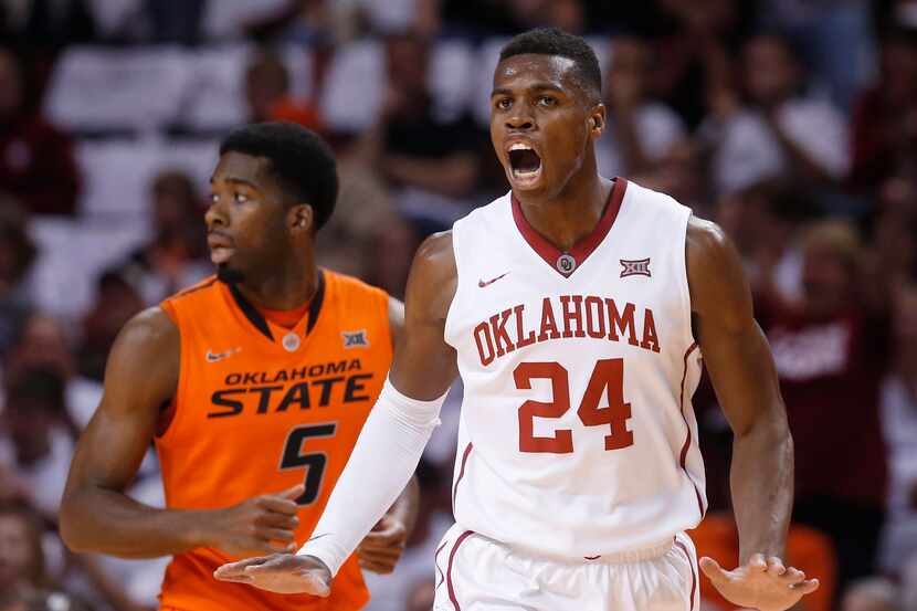 Oklahoma guard Buddy Hield (24) celebrates a basket in front of Oklahoma State guard...