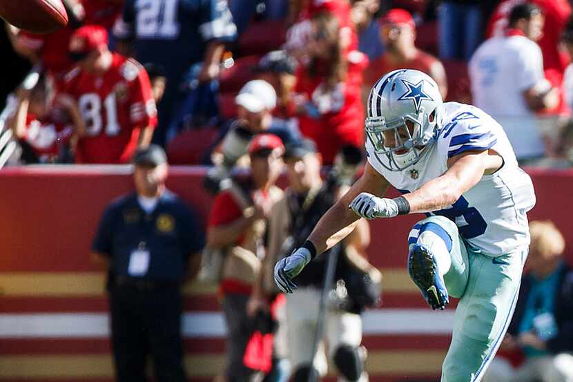 Dallas Cowboys strong safety Jeff Heath kicks off to start the during the second half of an...