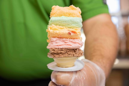 Training lead Bryan Feltman prepares the five "slices" in a classic Rainbow Cone (from the...