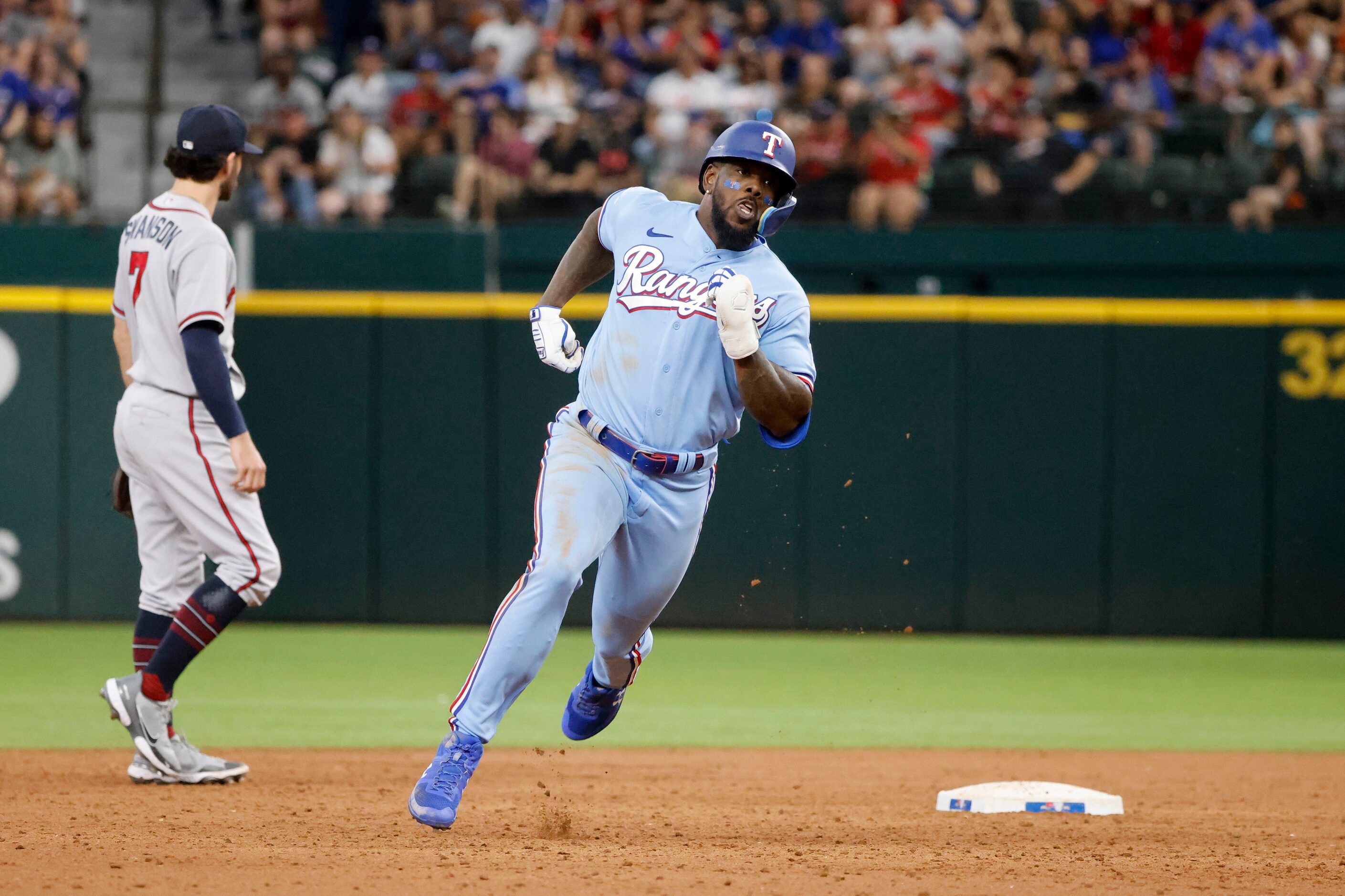 Texas Rangers right fielder Adolis Garcia (53) runs out his triple against the Atlanta...