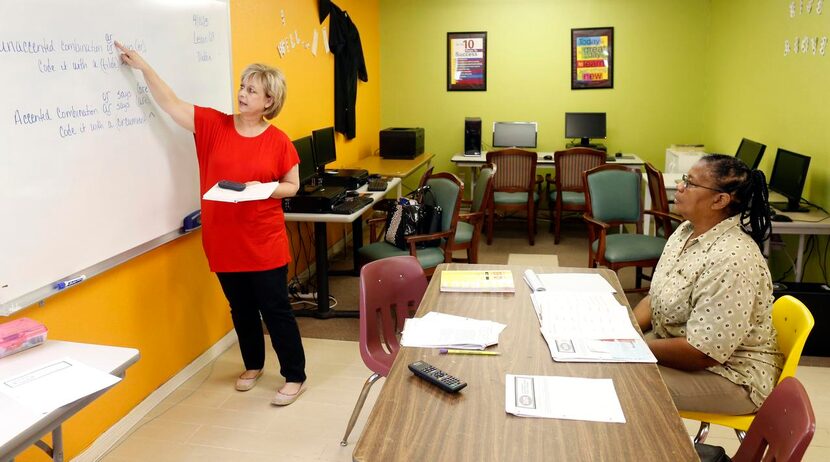 
Volunteer Debbie Epperson (left) teaches Jerutha Pratt how to read at Buckner Wynnewood...