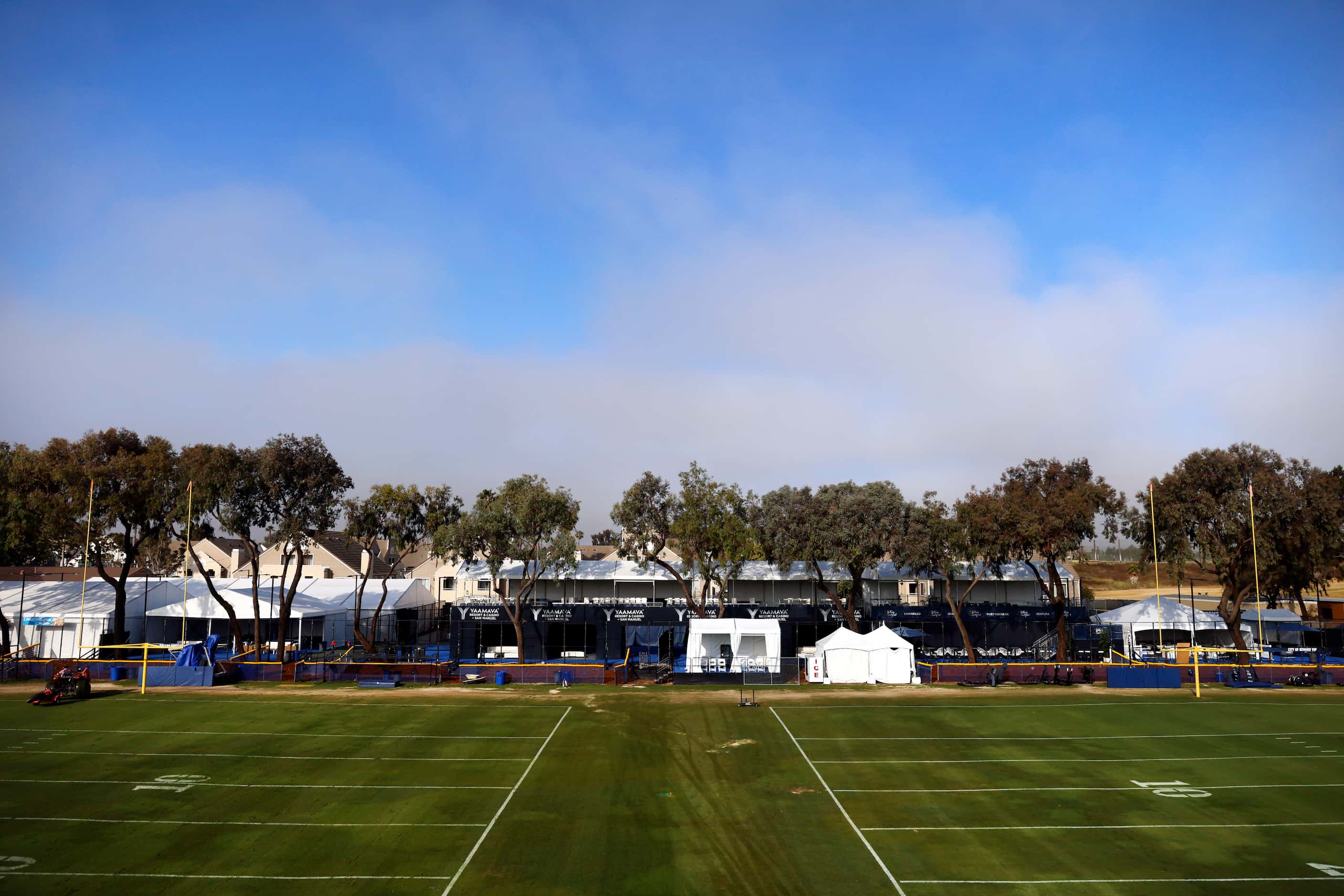 A marine layer of fog begins to lift above the Dallas Cowboys Training Camp setup in Oxnard,...