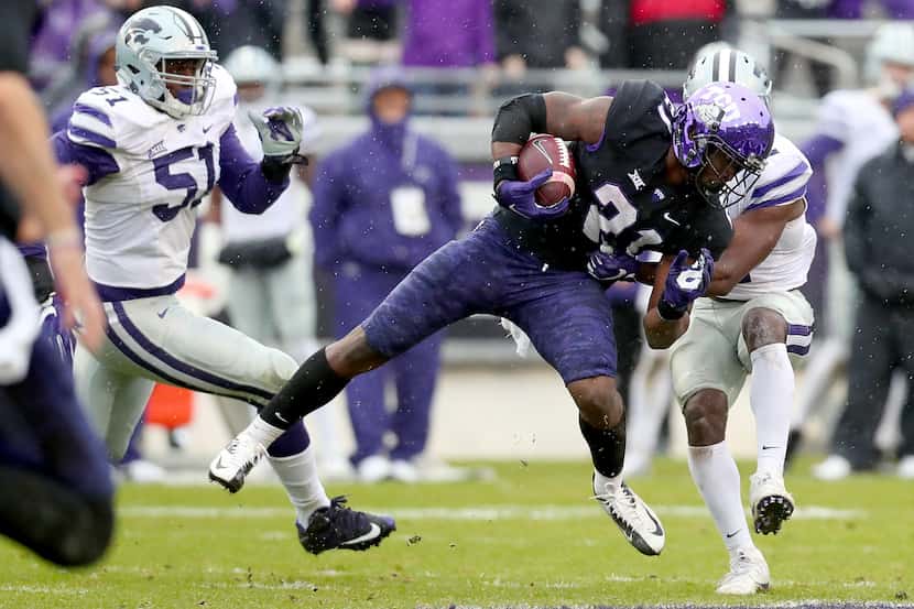 FORT WORTH, TX - DECEMBER 03: TCU's Kyle Hicks (#21) carries the ball against Kansas State's...