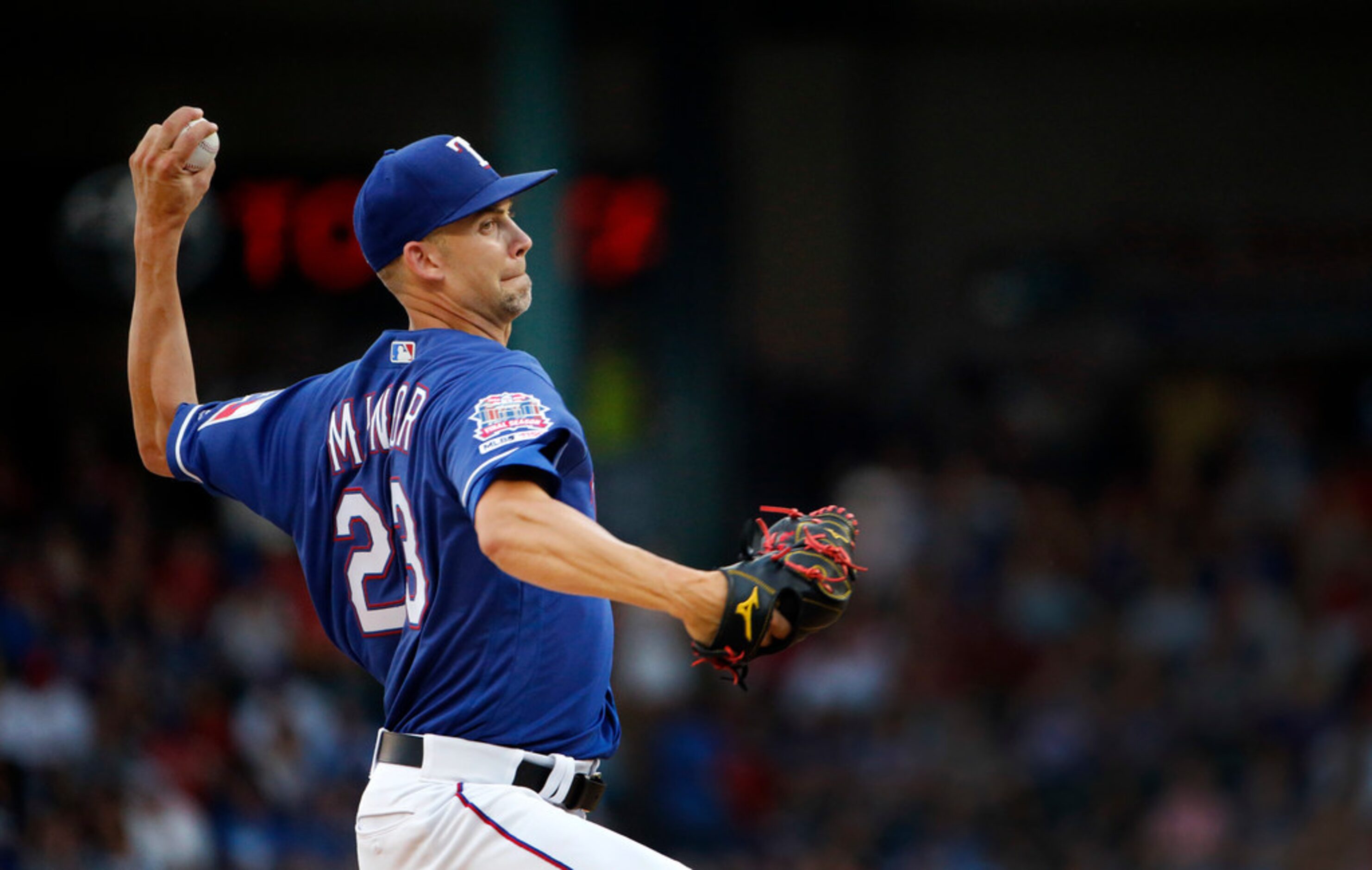 Texas Rangers starting pitcher Mike Minor (23) throws against the Houston Astros in the...