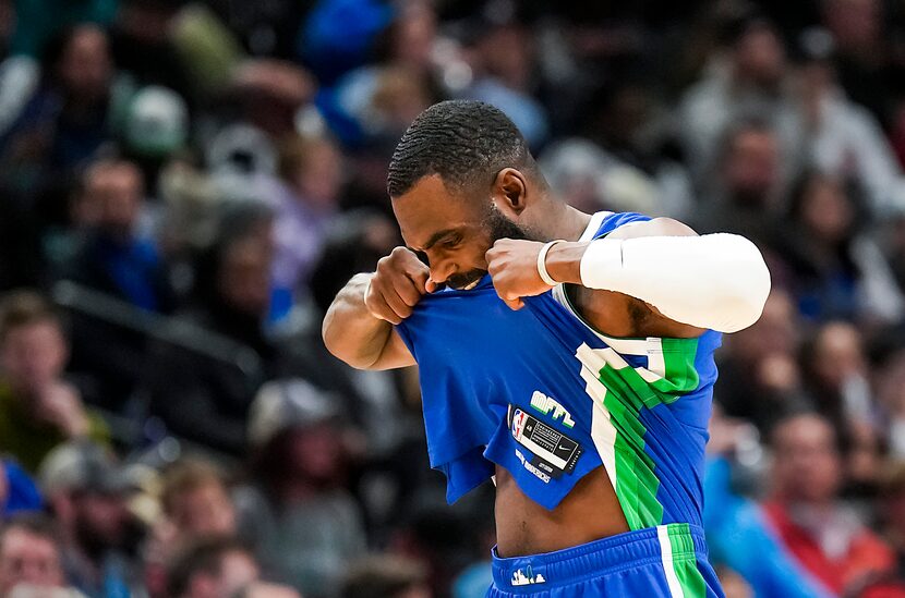 Dallas Mavericks forward Tim Hardaway Jr. tears his jersey after missing a 3-pointer during...