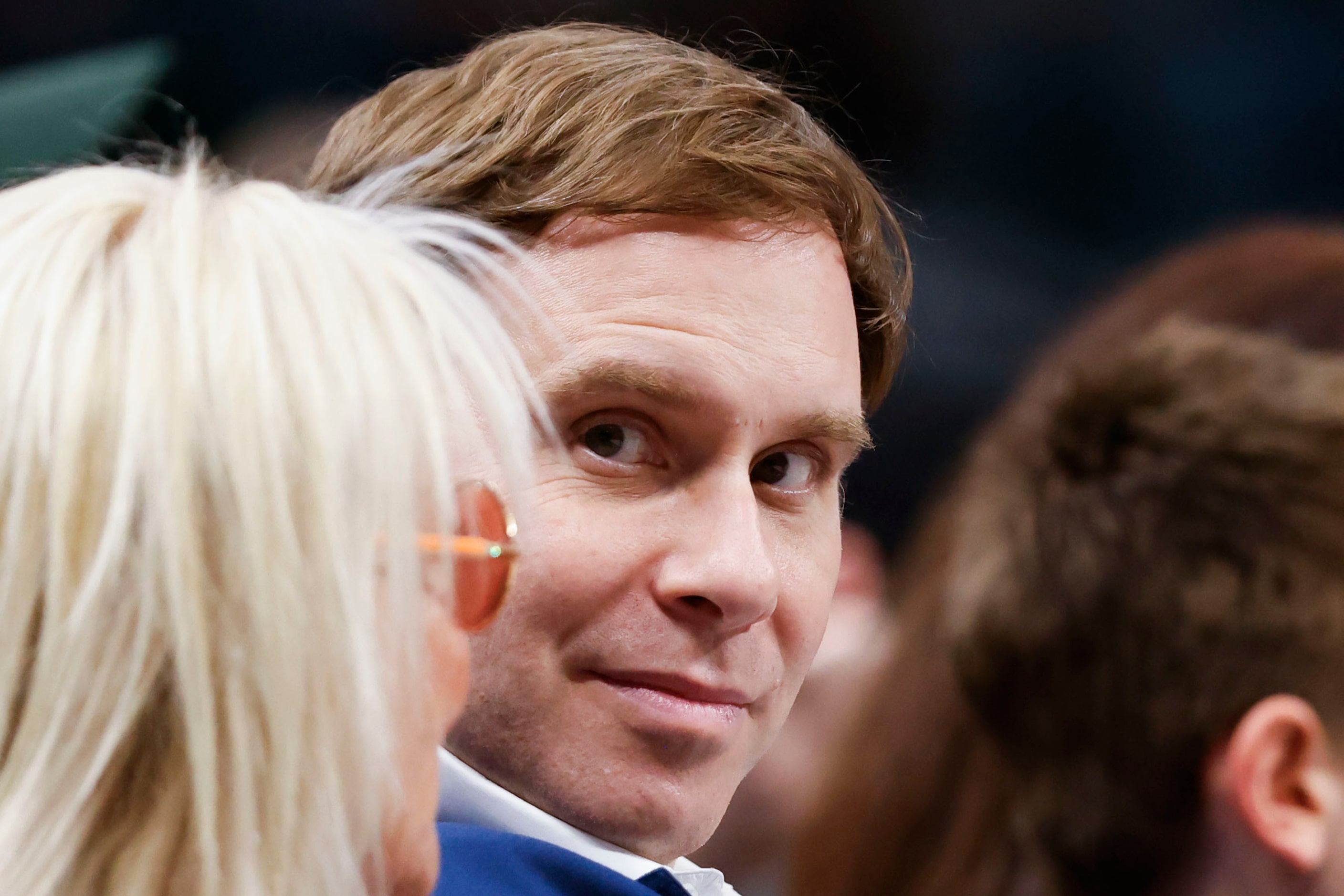 Mavericks Governor Patrick Dumont (center) remains in the court side during the first half...