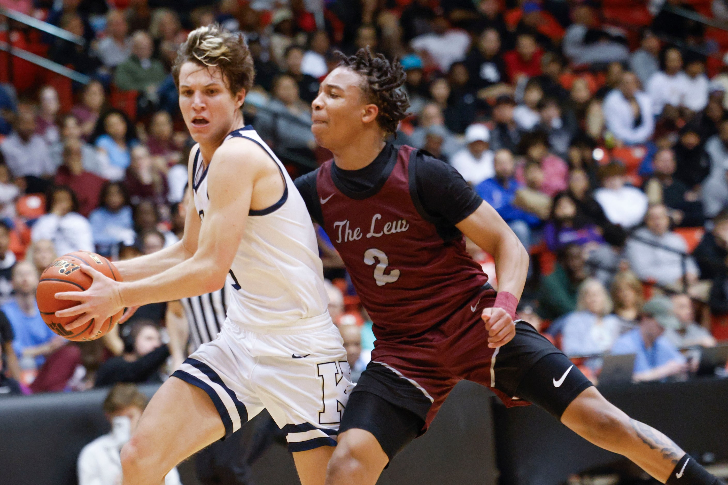 Keller High’s Quinn Estep (left) dribbles past Lewisville high’s Rakai Crawford during the...