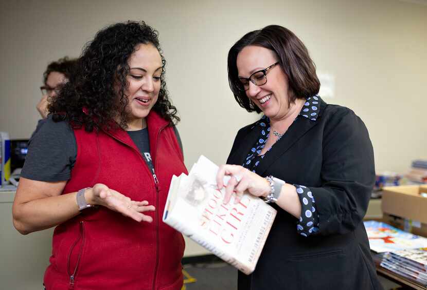 Hegar signs her 2017 book, "Shoot Like a Girl," for Maj. Joanna Orozco, deputy of support...