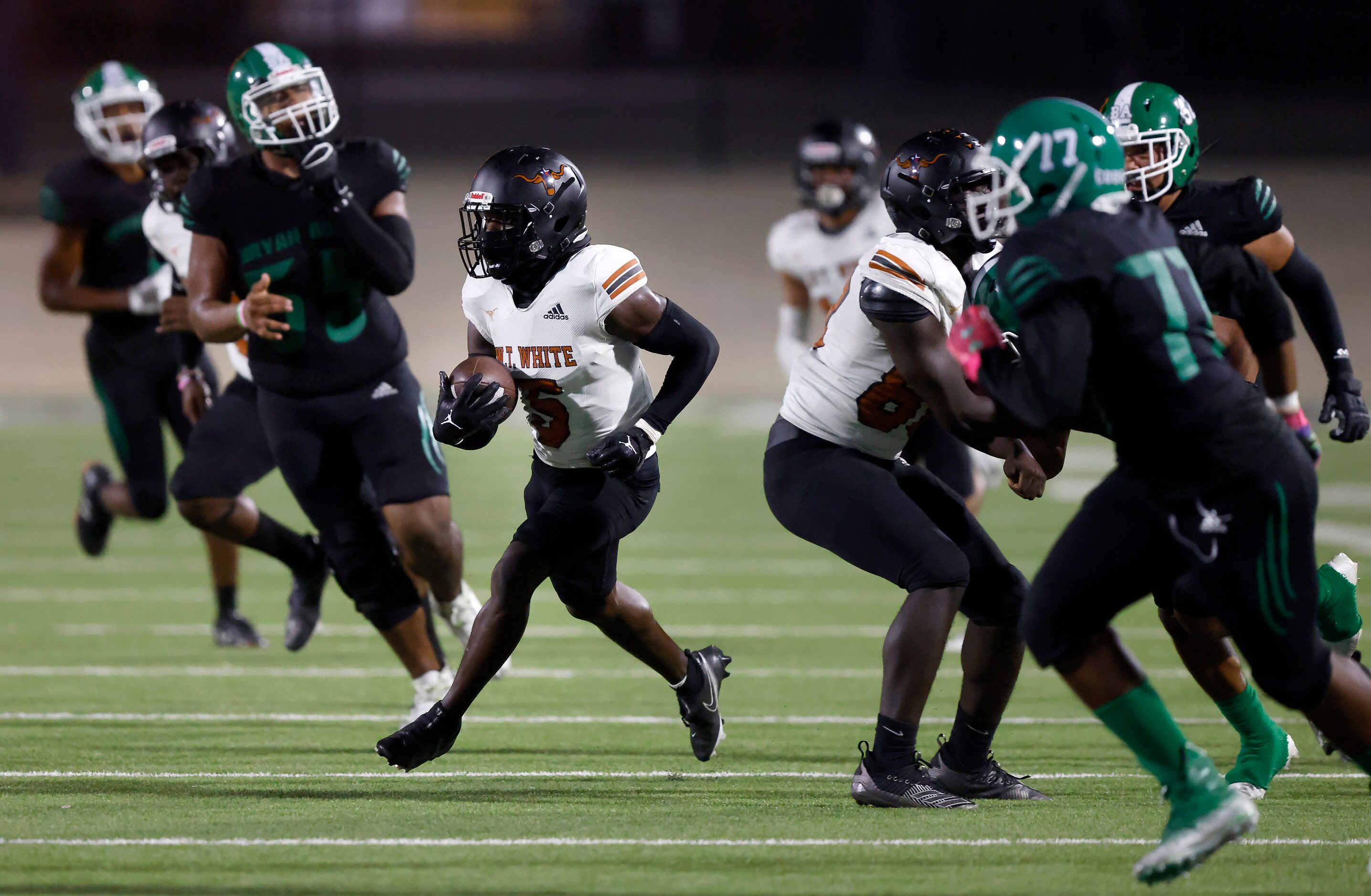 W.T. White cornerback Jacoi Ware (5) returns a second quarter interception by Bryan Adams at...