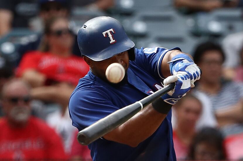 ANAHEIM, CA - SEPTEMBER 17: Elvis Andrus #1 of the Texas Rangers hits a foul ball during the...
