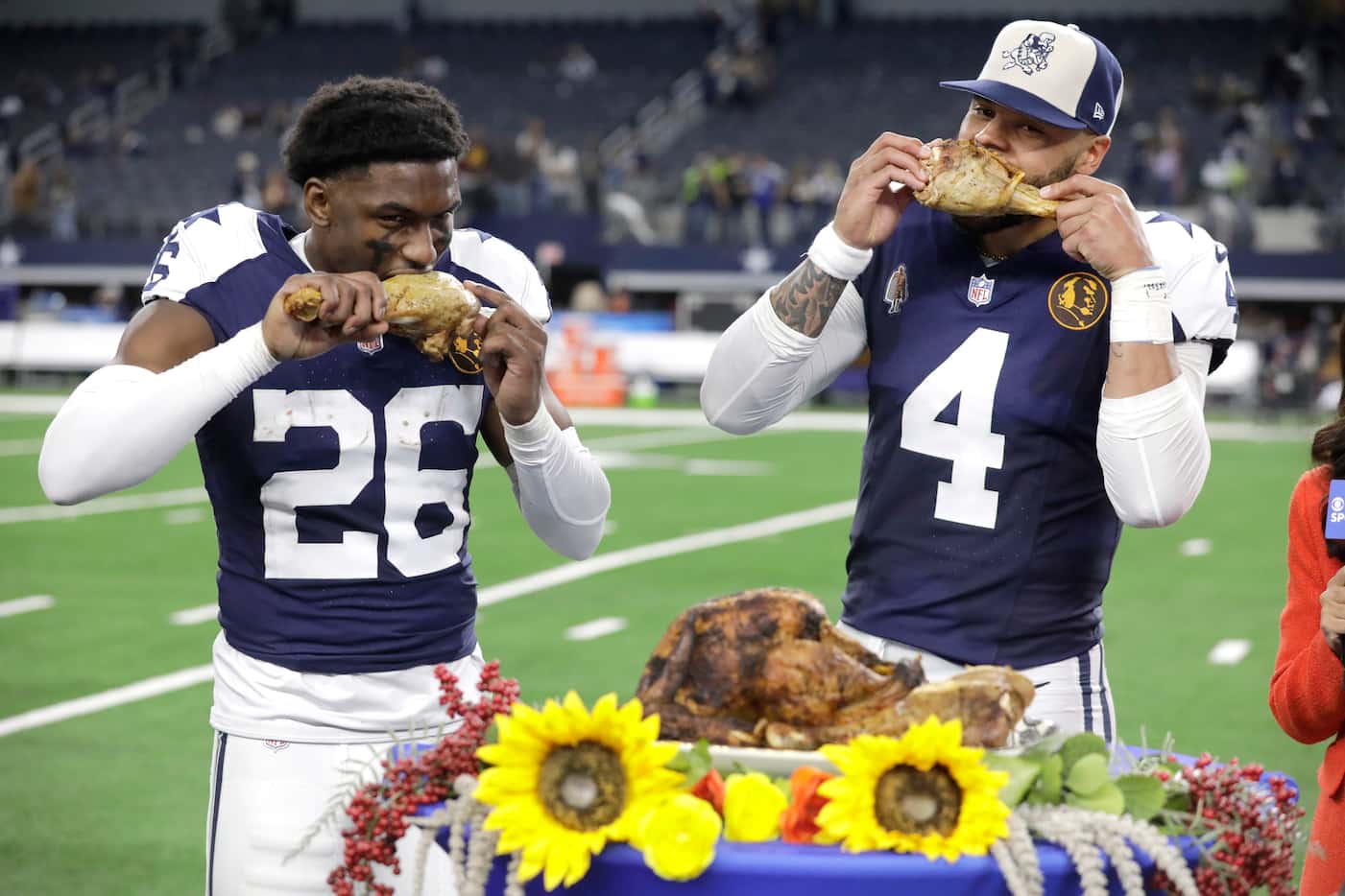 Dallas Cowboys cornerback DaRon Bland (26) and quarterback Dak Prescott (4) feast on turkey...