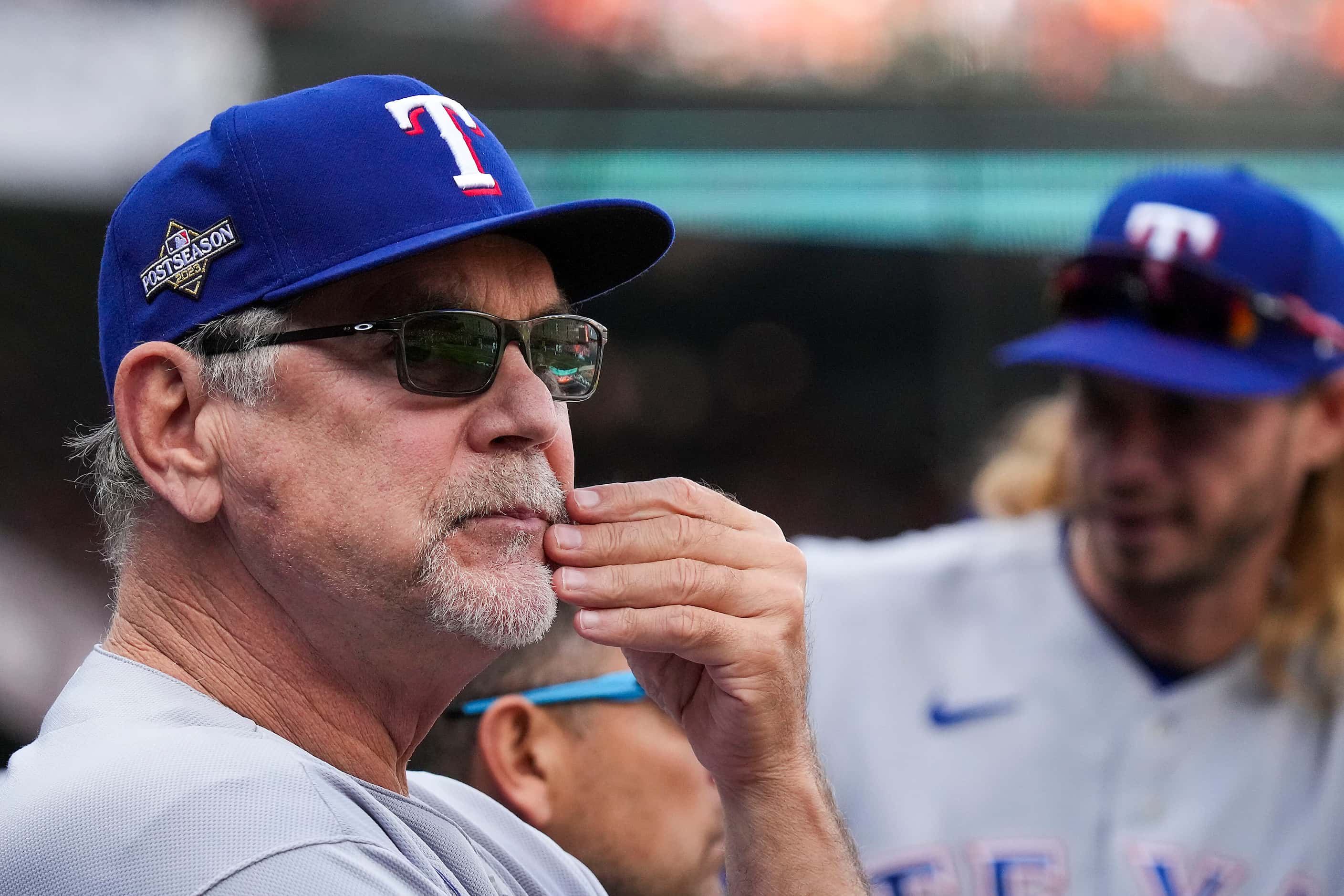 Texas Rangers manager Bruce Bochy looks on from the dugout during the fourth inning in Game...