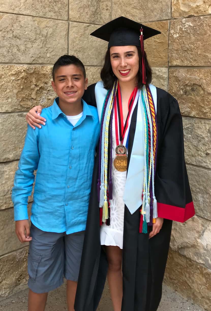 Hannah Ortega poses with her younger brother. 