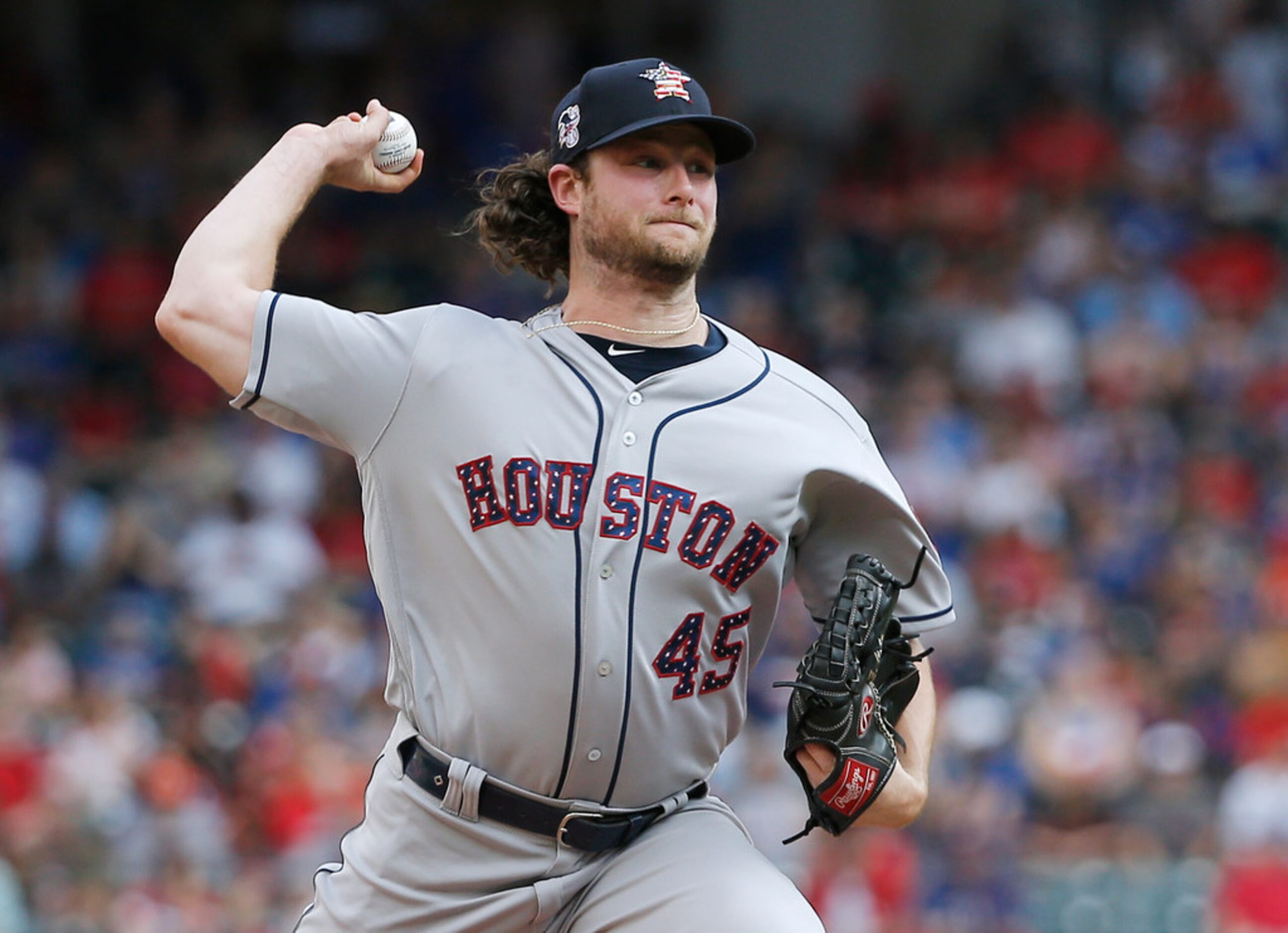 Houston Astros starting pitcher Gerrit Cole throws during the first inning of the team's...