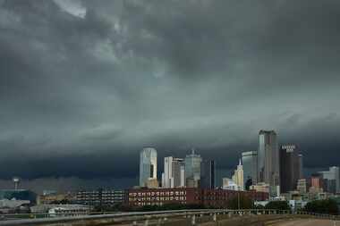 Storm clouds roll over the downtown skyline as severe storms move through North Texas.