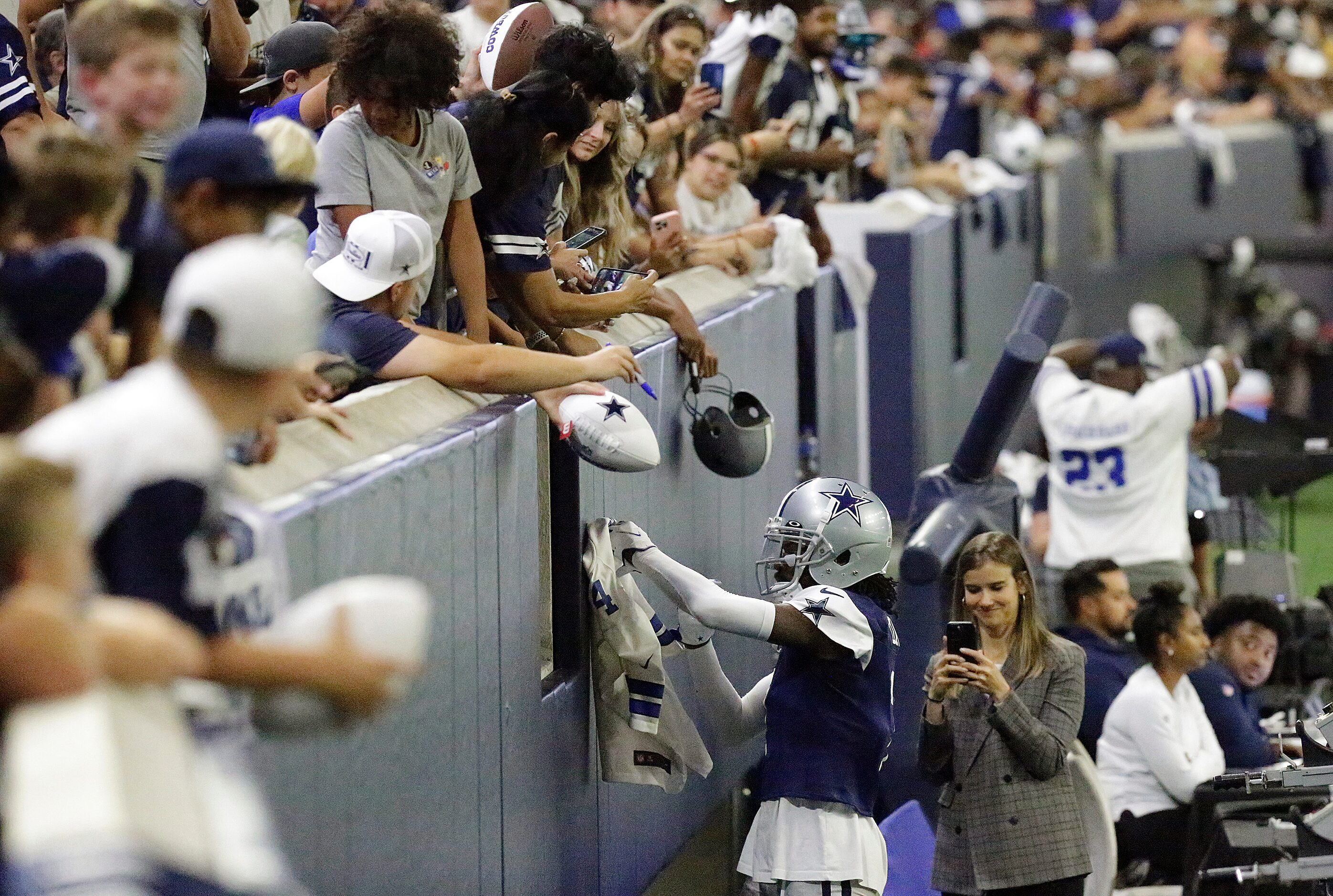 Dallas Cowboys cornerback Trevon Diggs (7) signs an autograph as the Dallas Cowboys held...