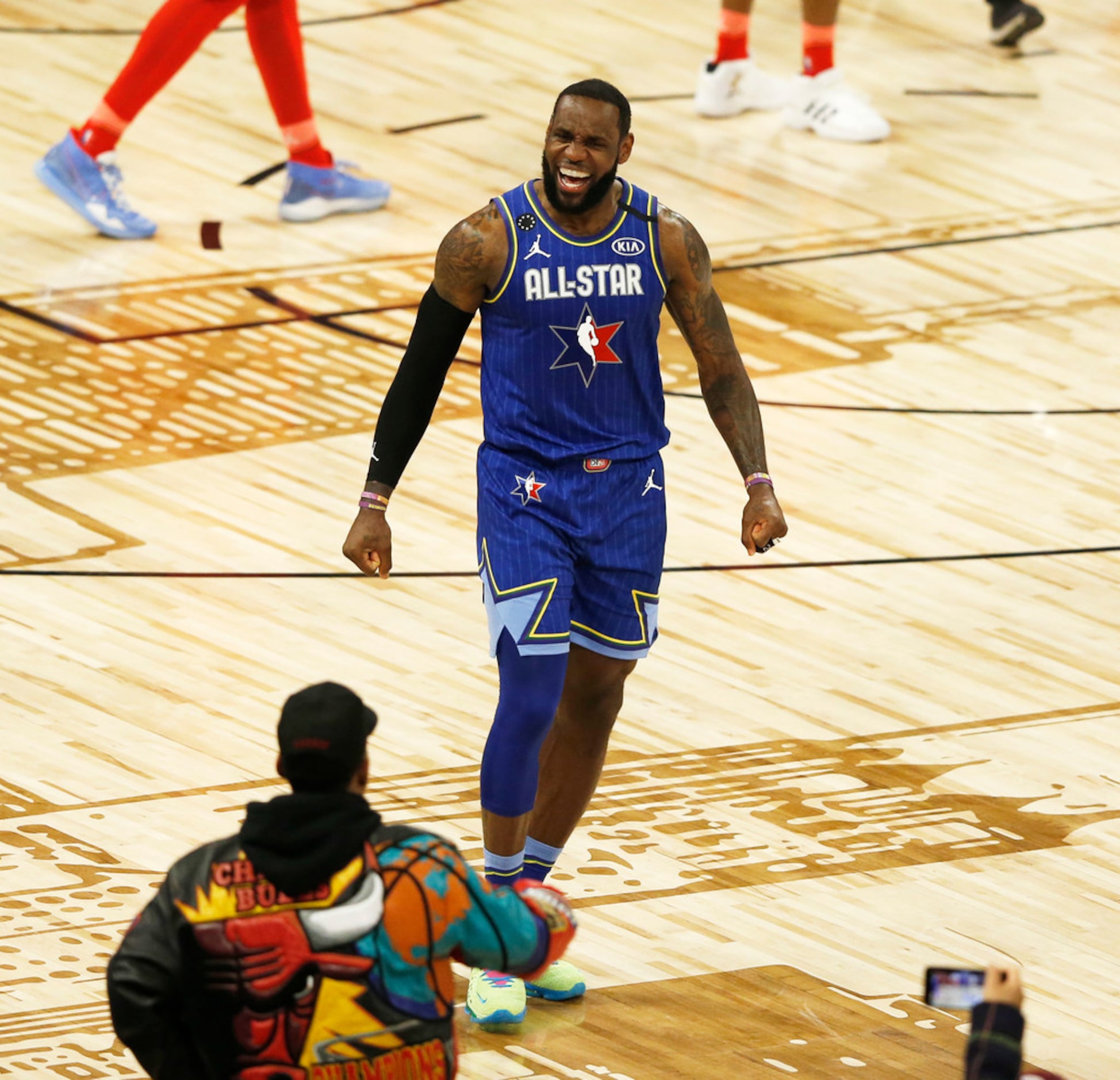 Team LeBron's LeBron James (2) celebrates after teammate Anthony Davis (2) made a free throw...