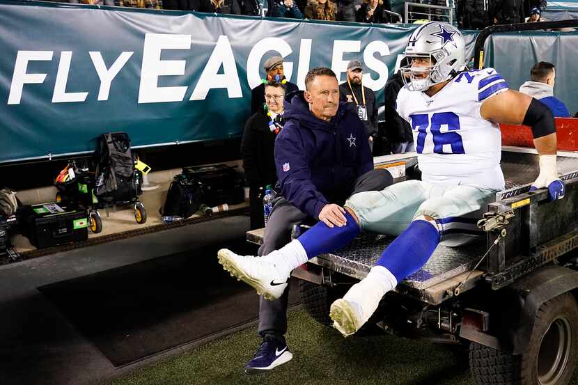 Dallas Cowboys offensive guard Xavier Su'a-Filo leaves the field on a cart after being...