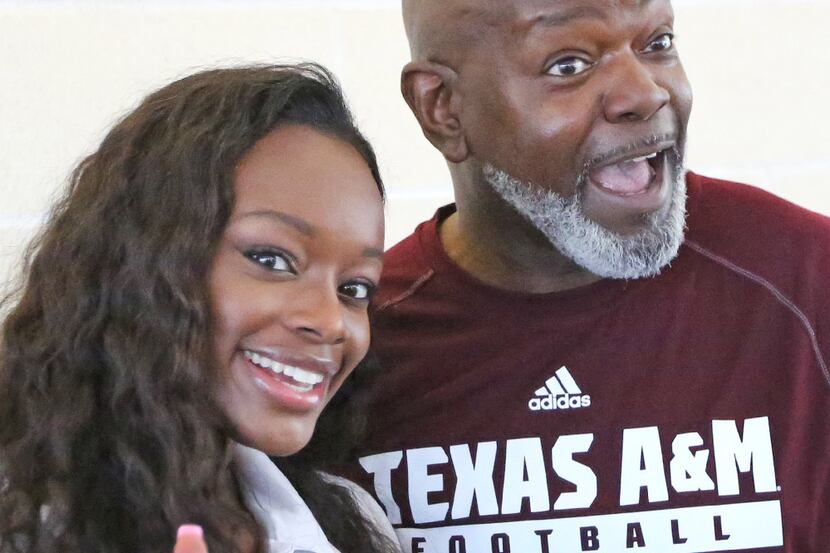 Dallas Cowboys Hall of Famer Emmitt Smith is pictured with his daughter Rheagen Smith as...
