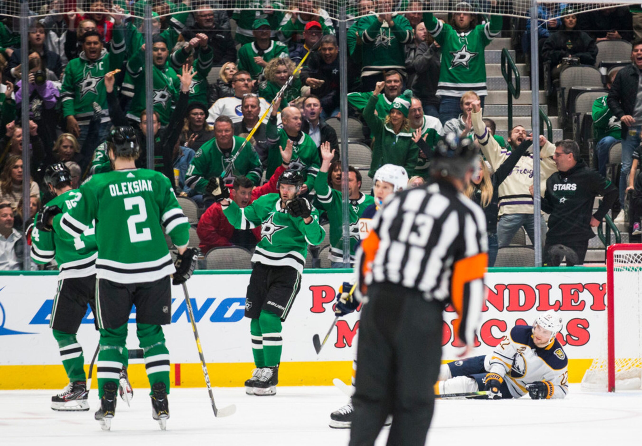 The Dallas Stars celebrate a goal by Dallas Stars left wing Jamie Benn (14) while Buffalo...