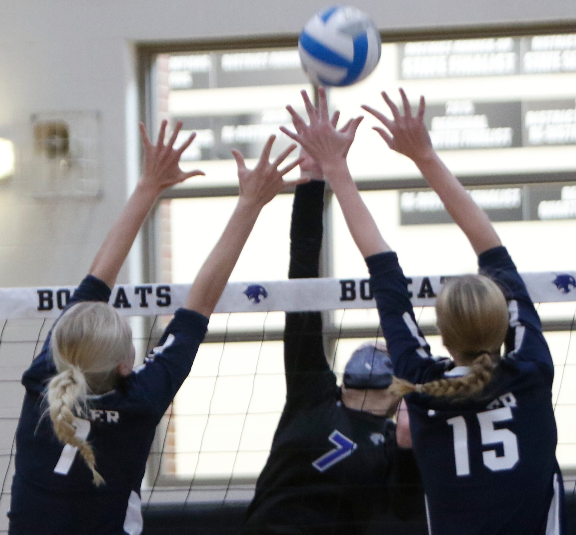 Trophy Club Byron Nelson's Nina Peterson (7) squeezes a shot for a score past the defense of...