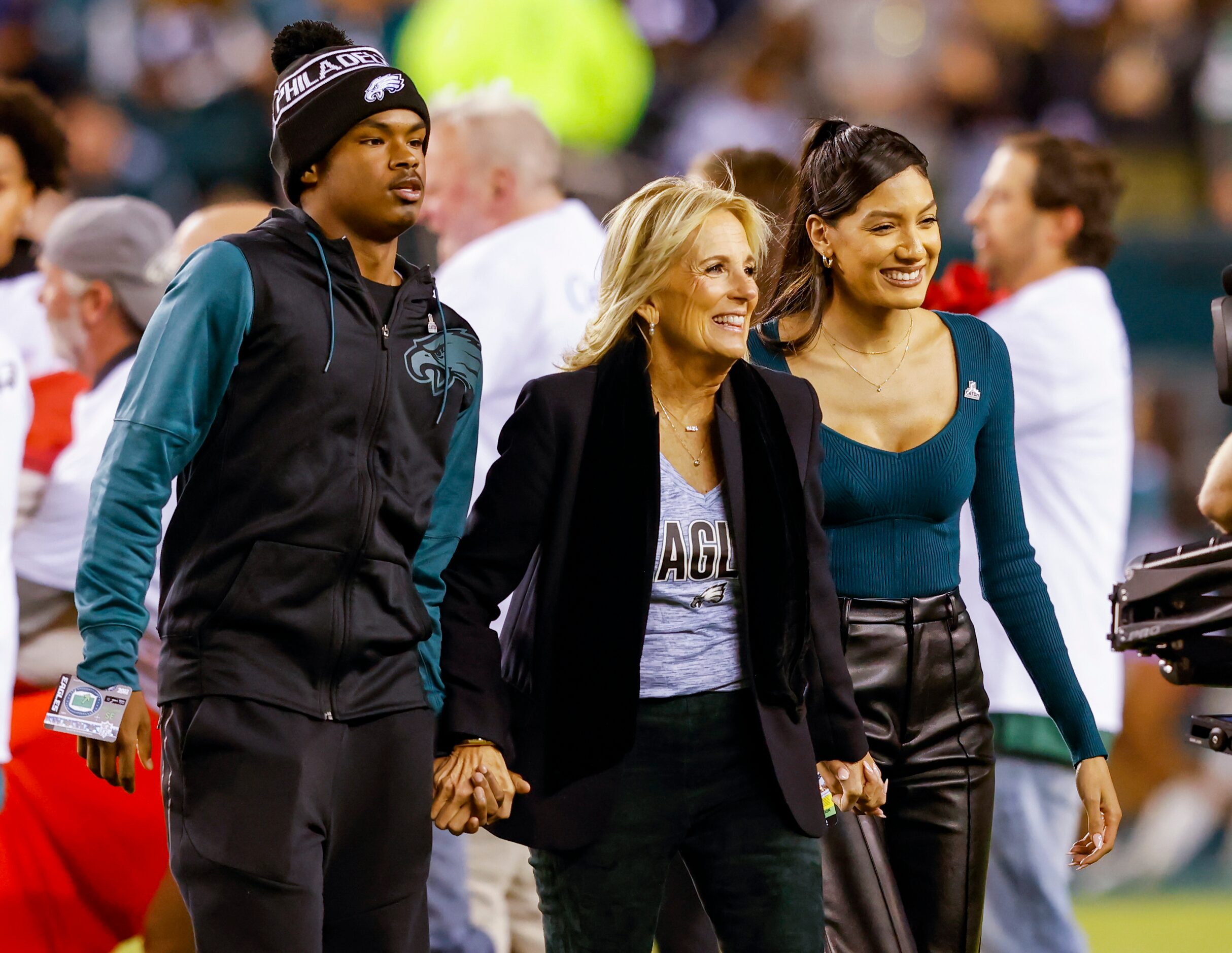 First Lady Jill Biden (center) walks off the field following the national anthem before the...