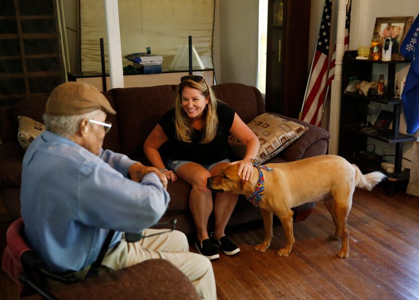 James Evans, 83, talks with Jeanne Marie Boyne (right), a volunteer for the Senior Pet...