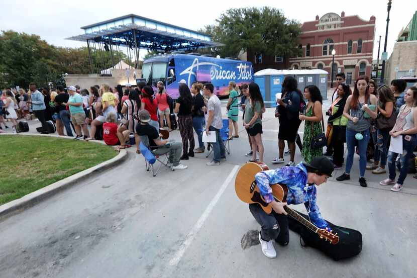 Spencer Williamson, 16, pulls out his guitar as contestants line up for a chance to sing for...