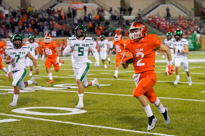 Celina wide receiver Collin Urich (2) returns the opening kickoff 91 yards for a touchdown...