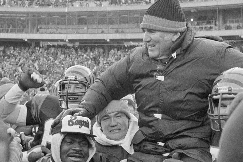 FILE - In this Jan. 10, 1982, file photo, Cincinnati Bengals coach Forrest Gregg is carried...