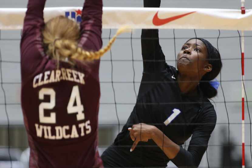 Hebron's Adanna Rollins (1) hits a shot against League City Clear Creek in the Class 6A...