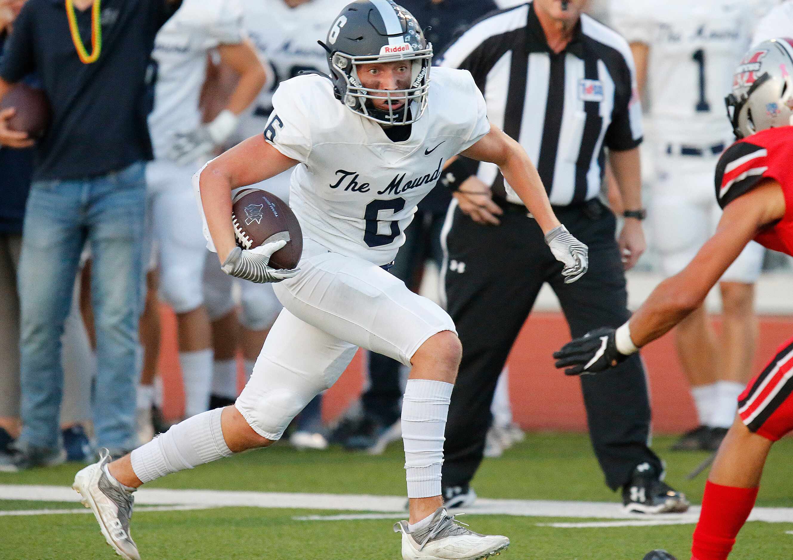 Flower Mound High School wide receiver Boston Lingenfelter (6) runs after the catch, close...
