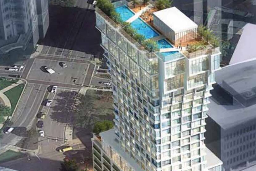 The 20-story hotel tower is under construction at Pearl and Olive streets in Dallas' Uptown...