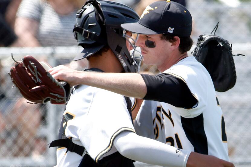 Forney pitcher Jonathan Childress (21), right, receives congratulations from catcher Nathan...