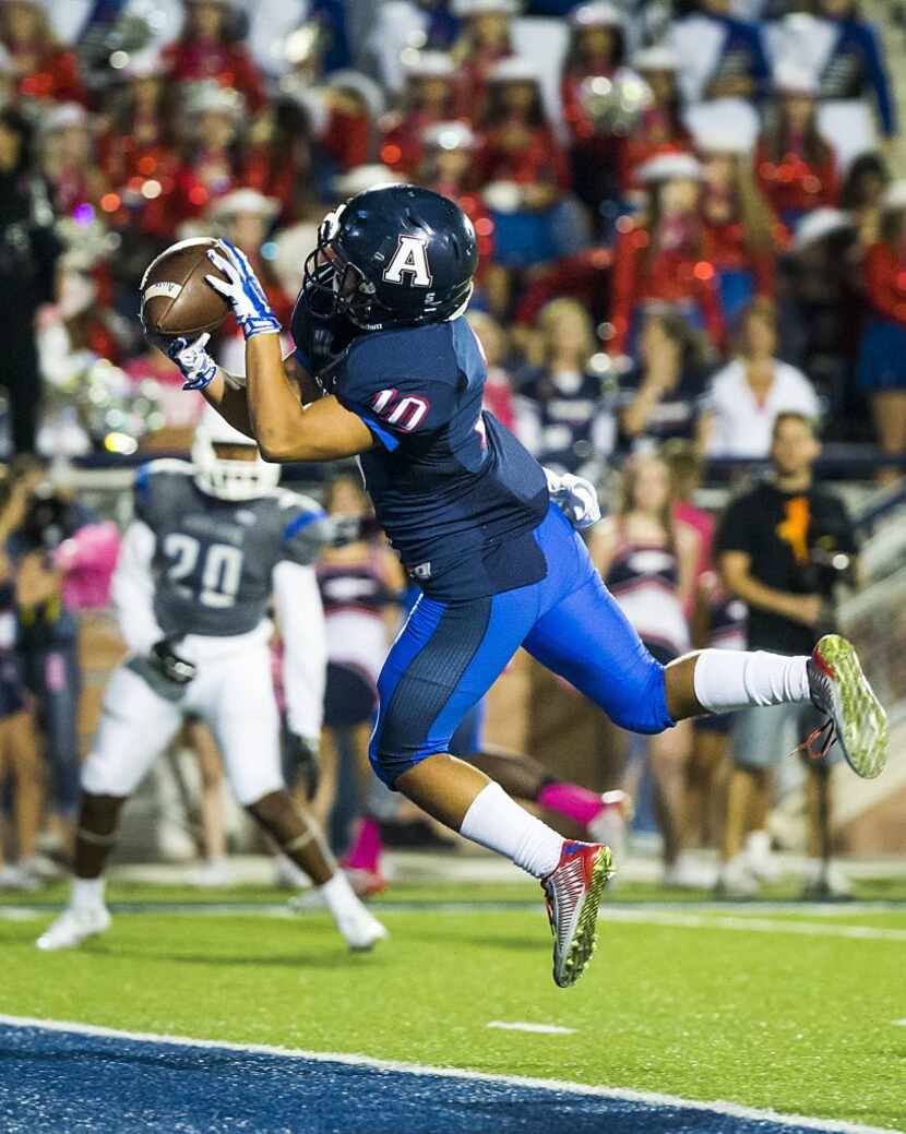 Allen wide receiver Jared Tajalle (10) catches a 24-yard touchdown pass during the first...