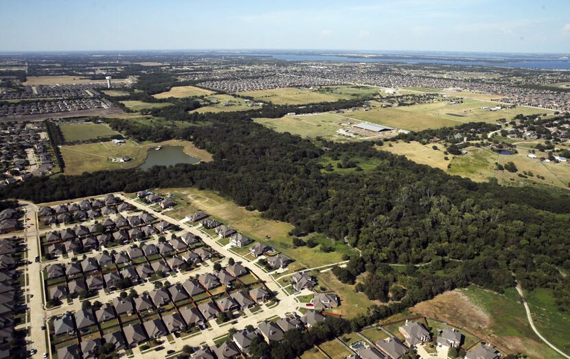 Aerial view of homes in Wylie with Lavon Lake in the distance on Thursday, August 11, 2016....