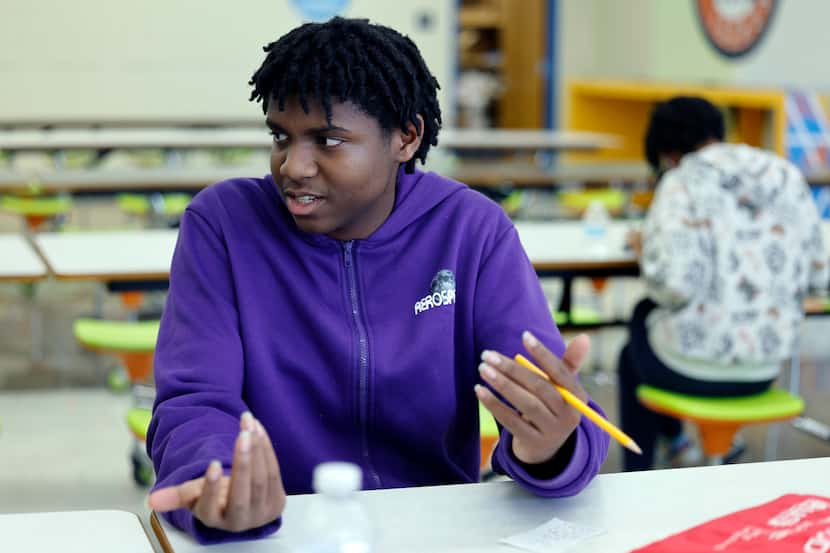 Isaiah Henry, 18, speaks with another student during an after school program at Sam Tasby...