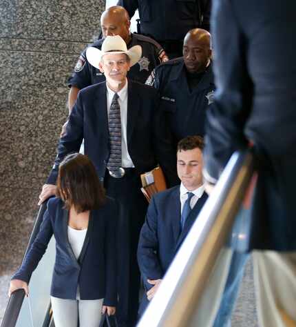 Johnny Manziel takes the escalator after making a court appearance. 