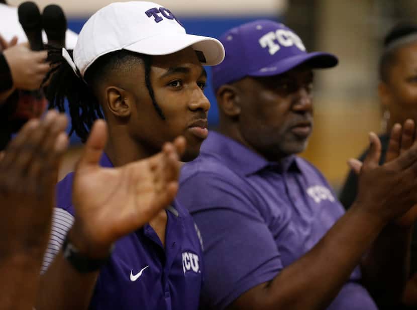 Midlothian basketball player Kaden Archie reacts after signing a national letter of intent...