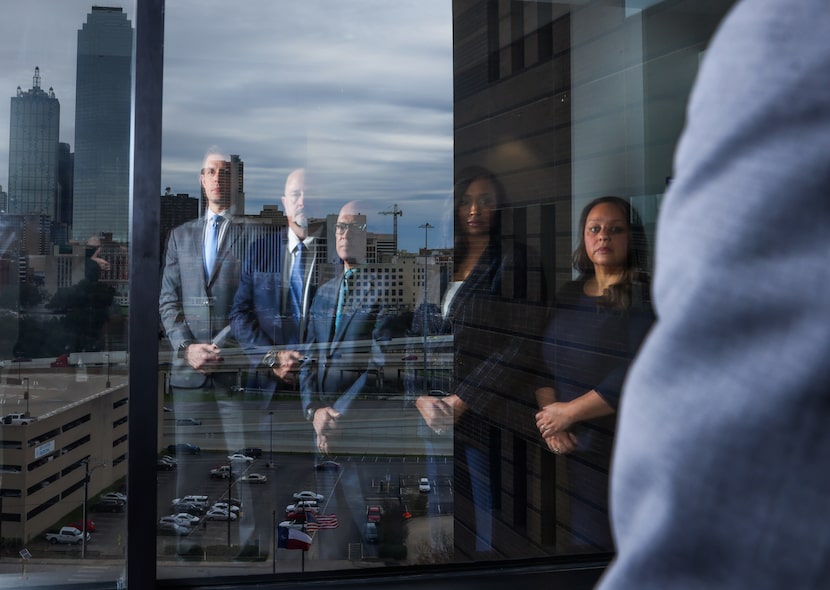 District Attorney John Creuzot, center, and members of his office's new vehicular crimes...