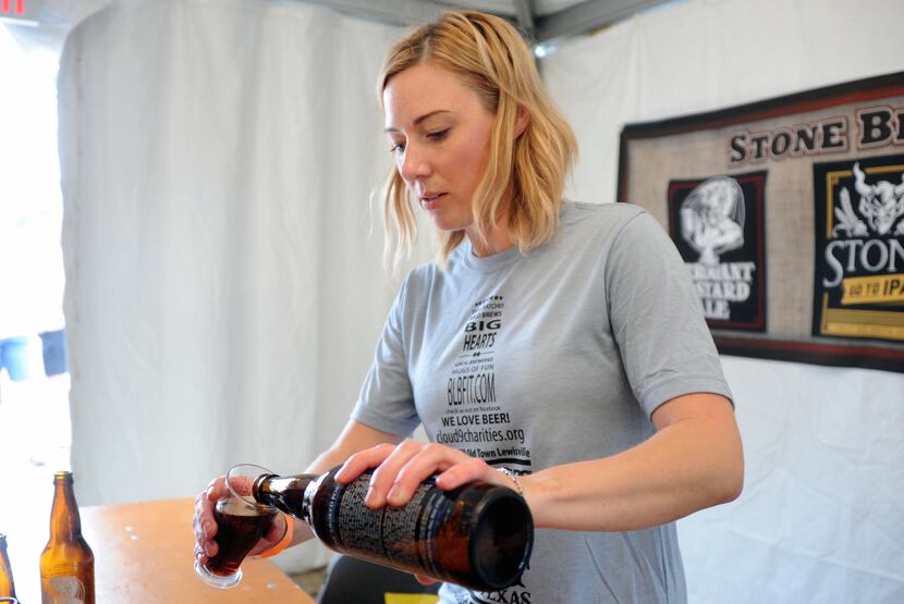 Dixie Dean of Stone Brewery pours a Smoked Porter for at the 2014 Best Little Brewfest in...
